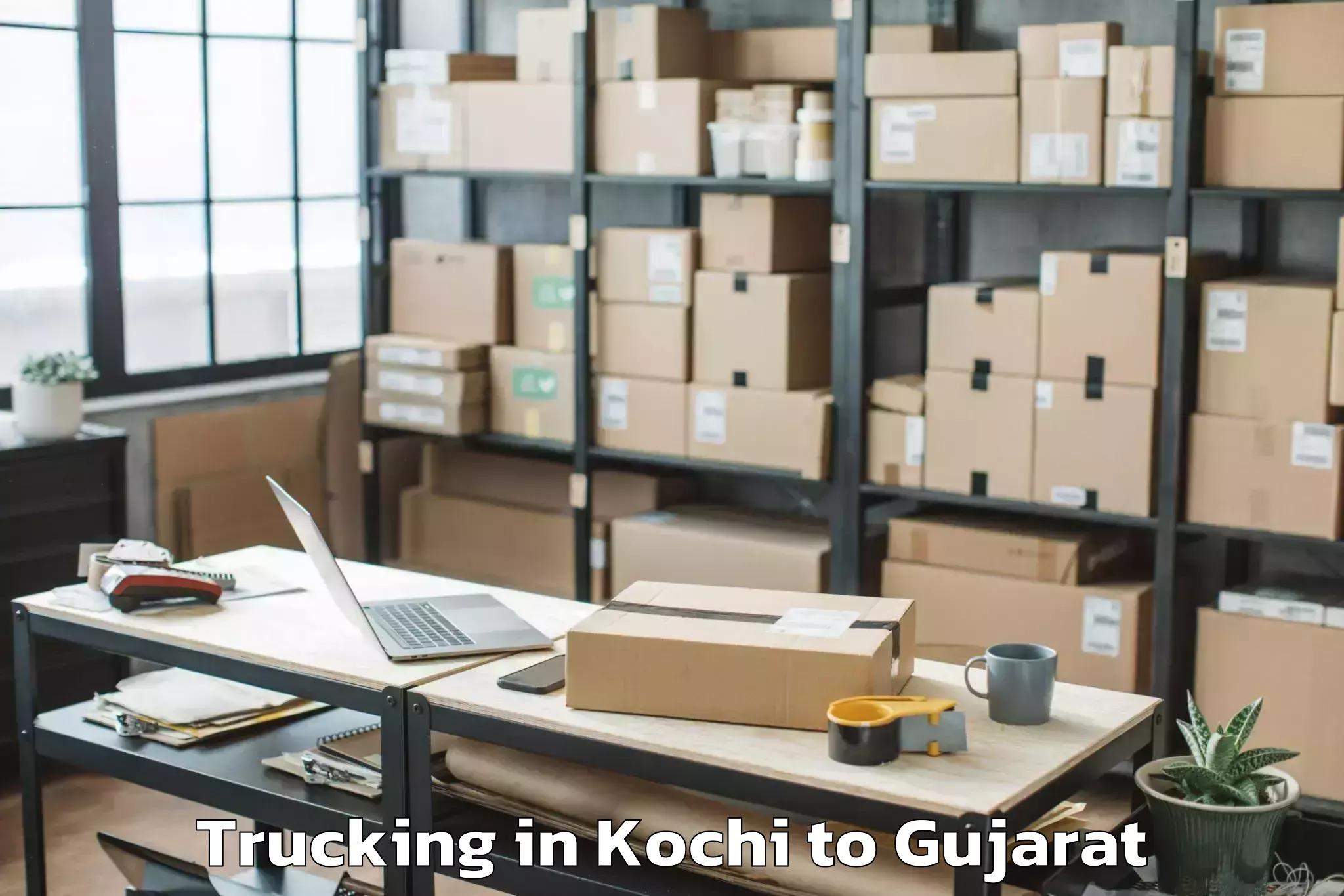 Book Kochi to Junagadh Agricultural Universi Trucking Online